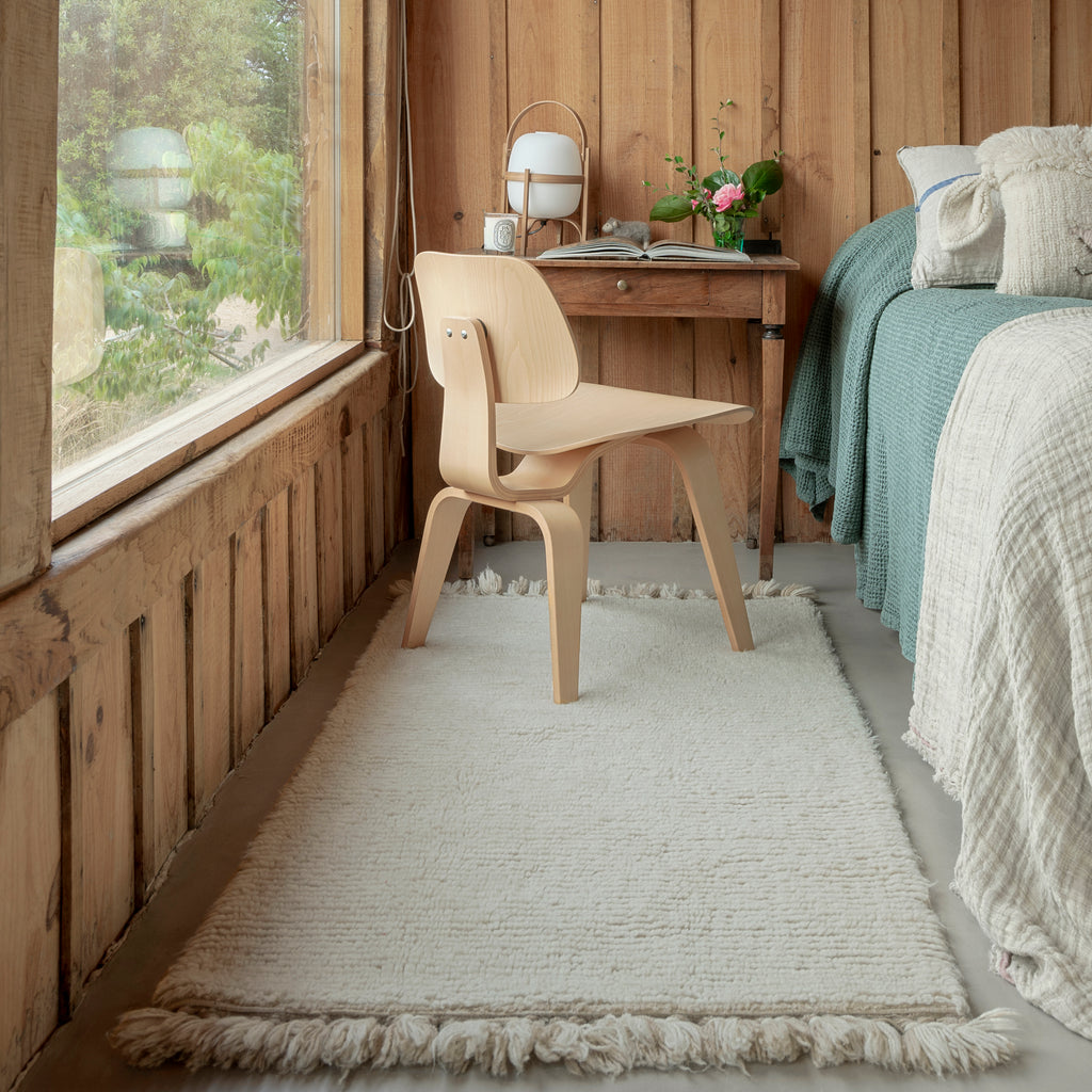 Tapis laine pompons