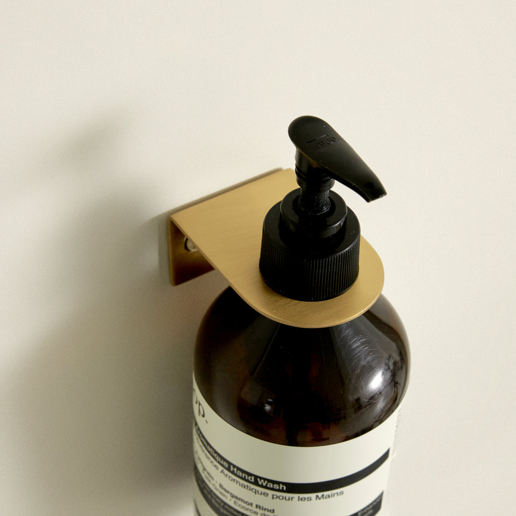 Support mural pour distributeur de savon