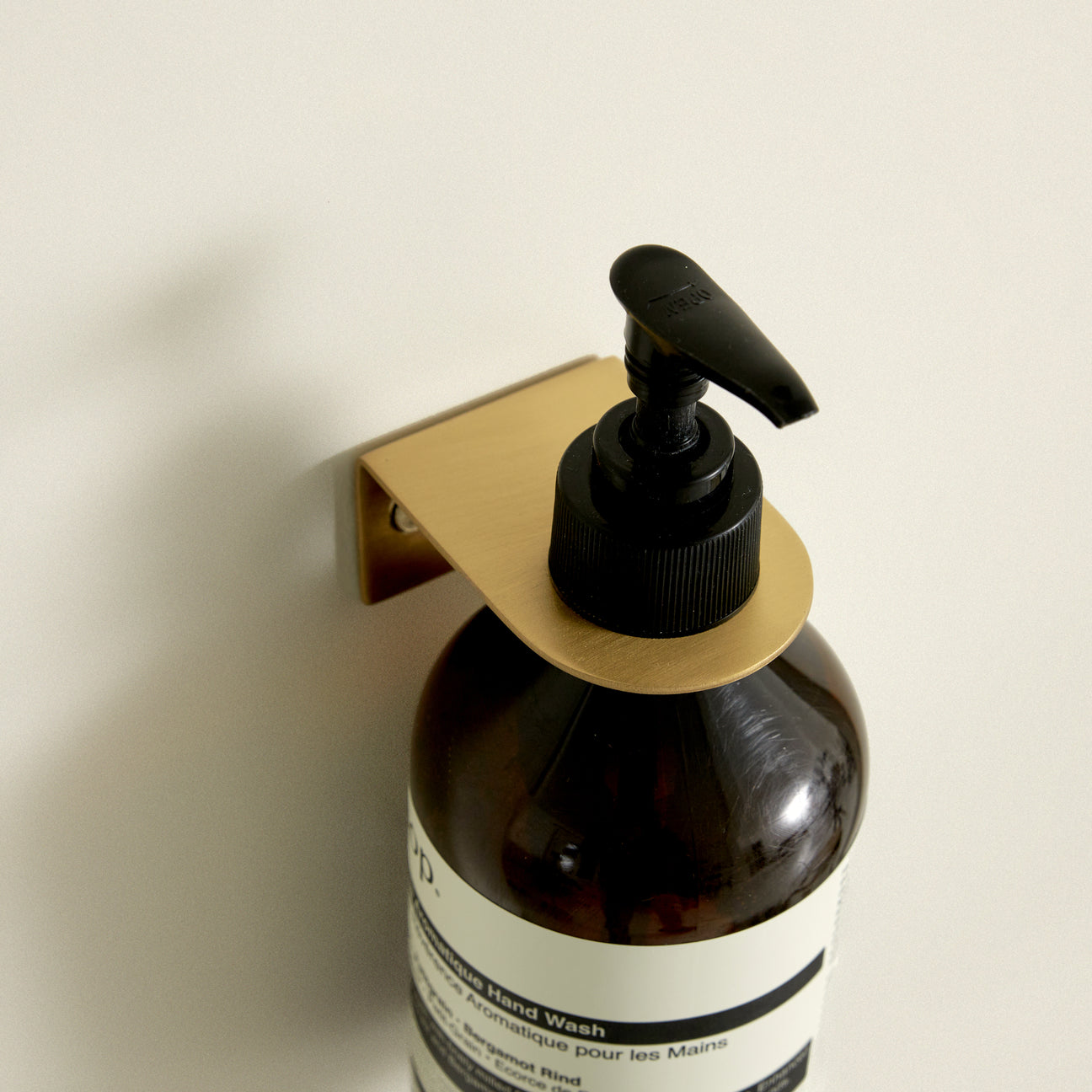 Support mural pour distributeur de savon